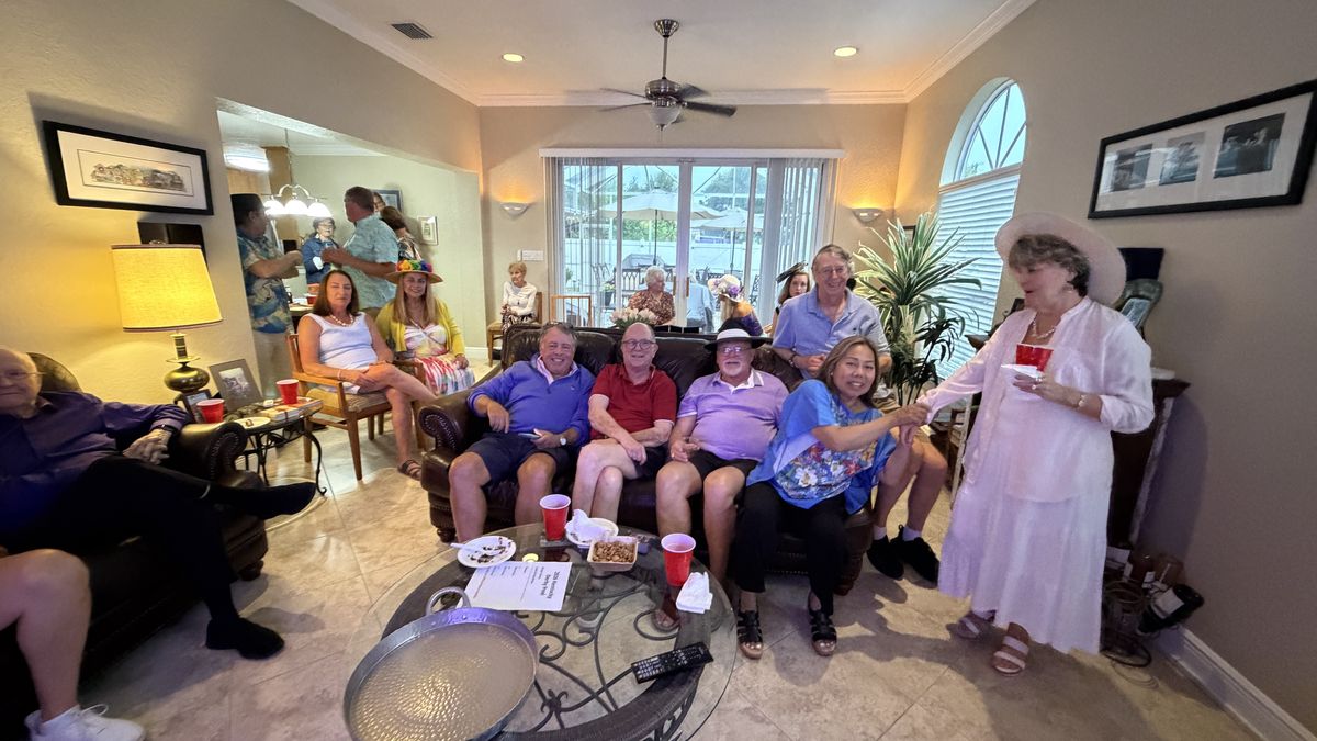 Members gathered at a Kentucky Derby party
