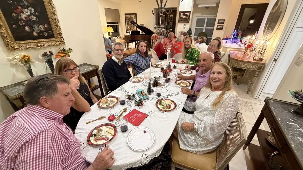 Members at a holiday dinner party