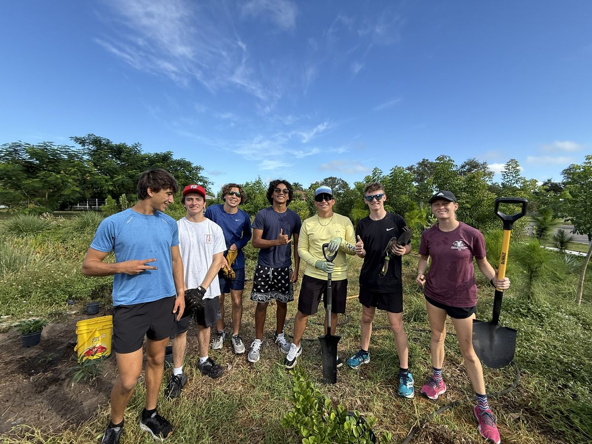 Rotary Interact students from Riverview High School planting at the Jacaranda microforest